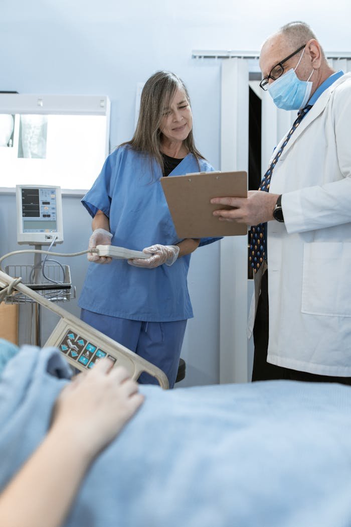Doctor and nurse discussing patient care in a hospital setting